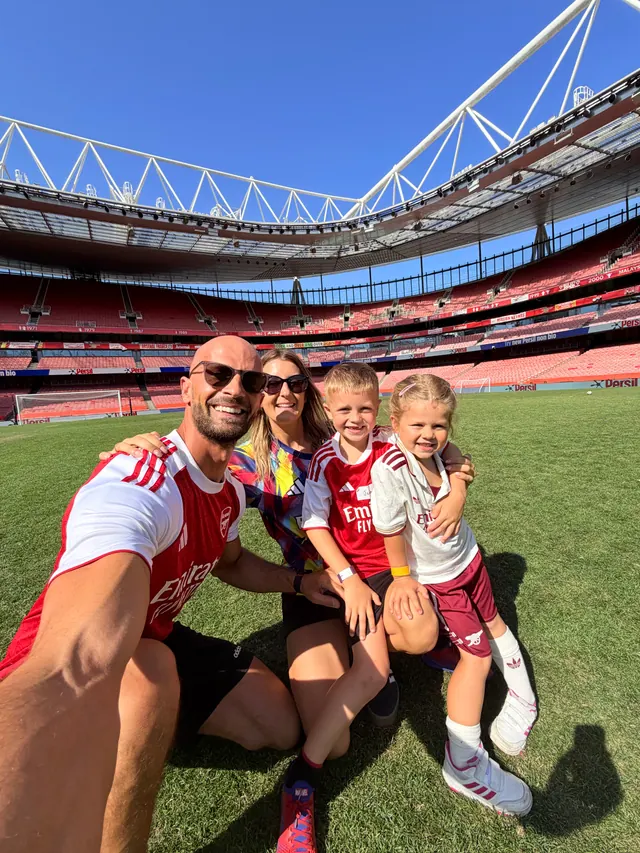 Daniel, Kelly and the children on the pitch at the Emirates Stadium