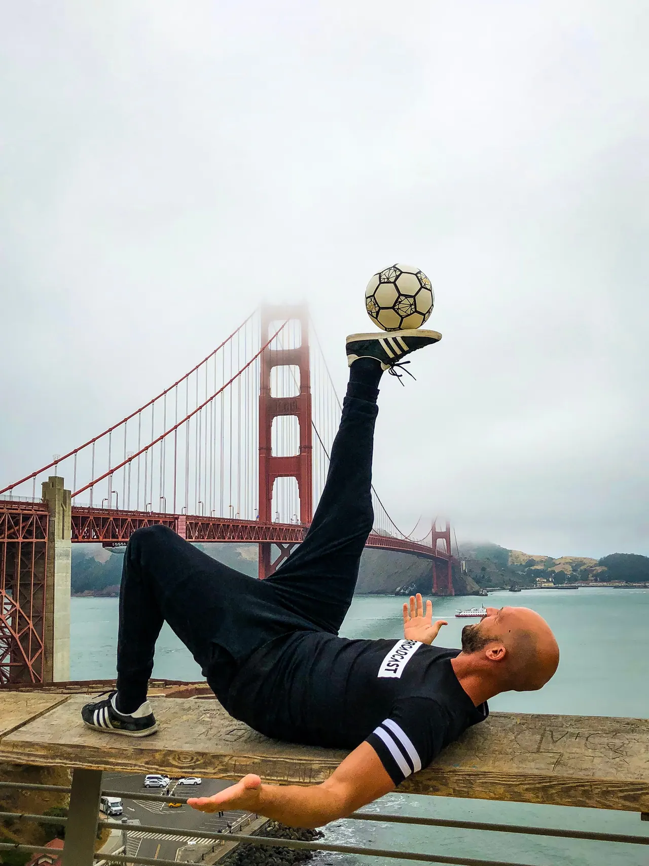 Daniel balancing a ball in front of the Golden Gate Bridge